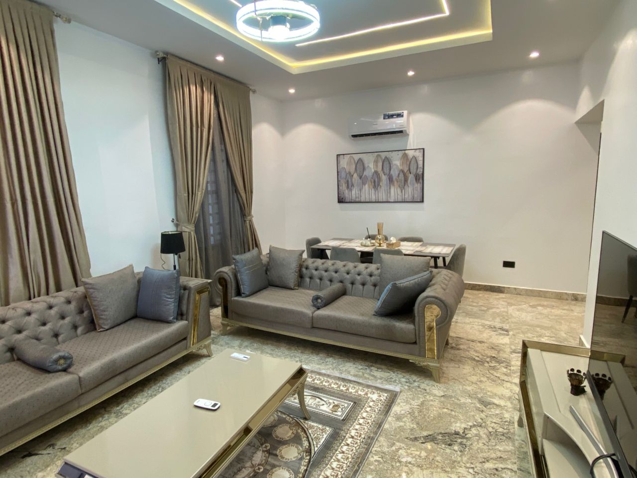 3 Bedroom Executive Apartment lounge with gold-carved sofa set